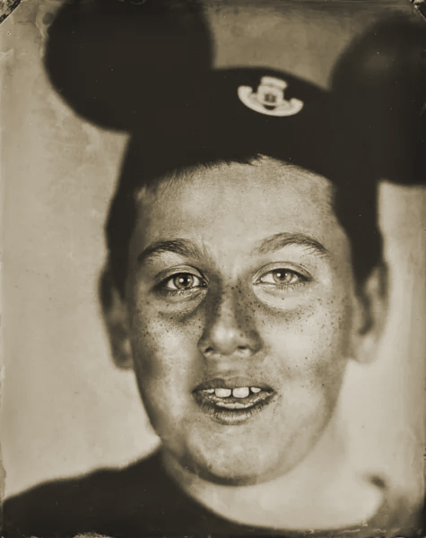James wearing Mickey Mouse ears in a birthday tintype portrait by Chuck Davis in Arkansas